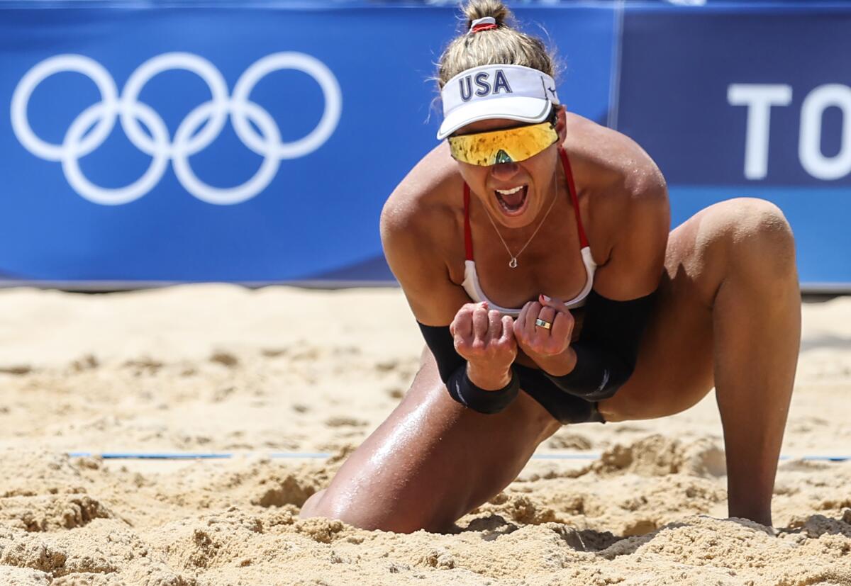 April Ross celebrates after capturing the Olympics Beach Volleyball Women's Gold Medal Match in Tokyo in 2021.