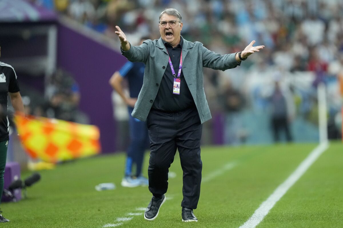 Mexico coach Tata Martino calls out to his players during a World Cup loss to Argentina on Saturday.