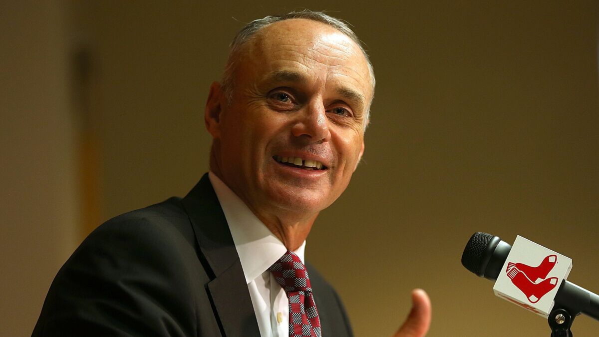 Major League Baseball Commissioner Rob Manfred speaks to reporters at Boston's Fenway Park on June 16.