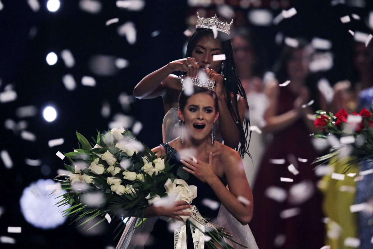 Camille Schrier of Virginia basks in the spotlight after winning the Miss America competition in Uncasville, Conn., on Thursday.