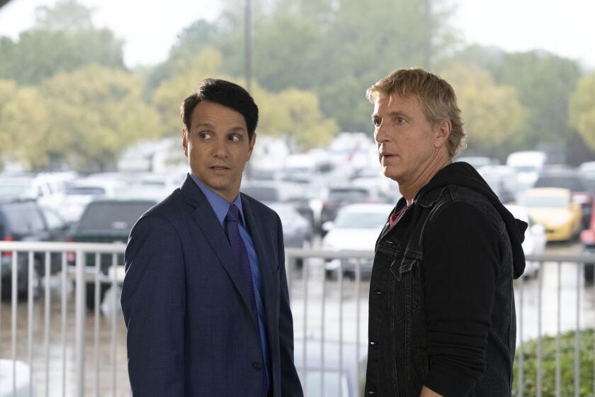 COBRA KAI (L to R) RALPH MACCHIO as DANIEL LARUSSO and WILLIAM ZABKA as JOHNNY LAWRENCE of COBRA KAI Cr. CURTIS BONDS BAKER/NETFLIX © 2020