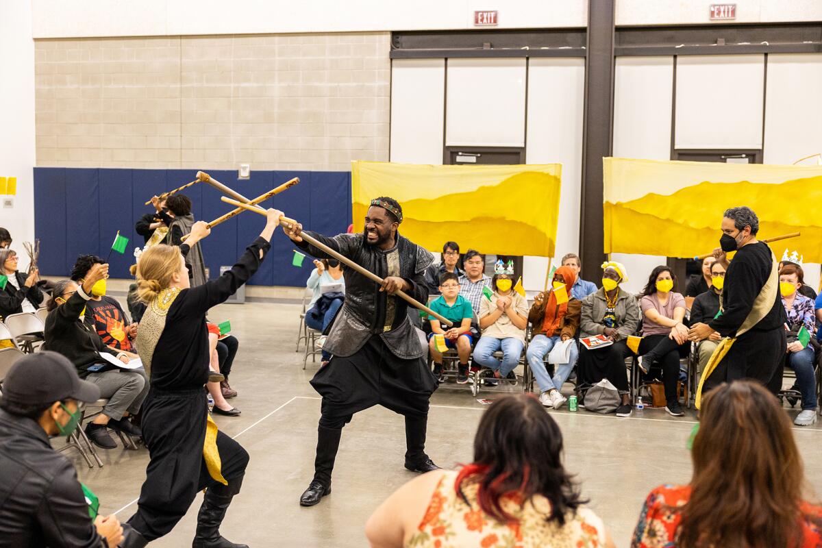 The Globe for All company of Shakespeare's "Henry V" performs for an audience in 2022.