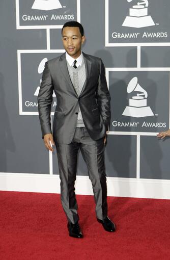 John Legend wore an anything-but-basic suit in gray silk shantung by Prada. Love the mesh sweater and leather tie too.