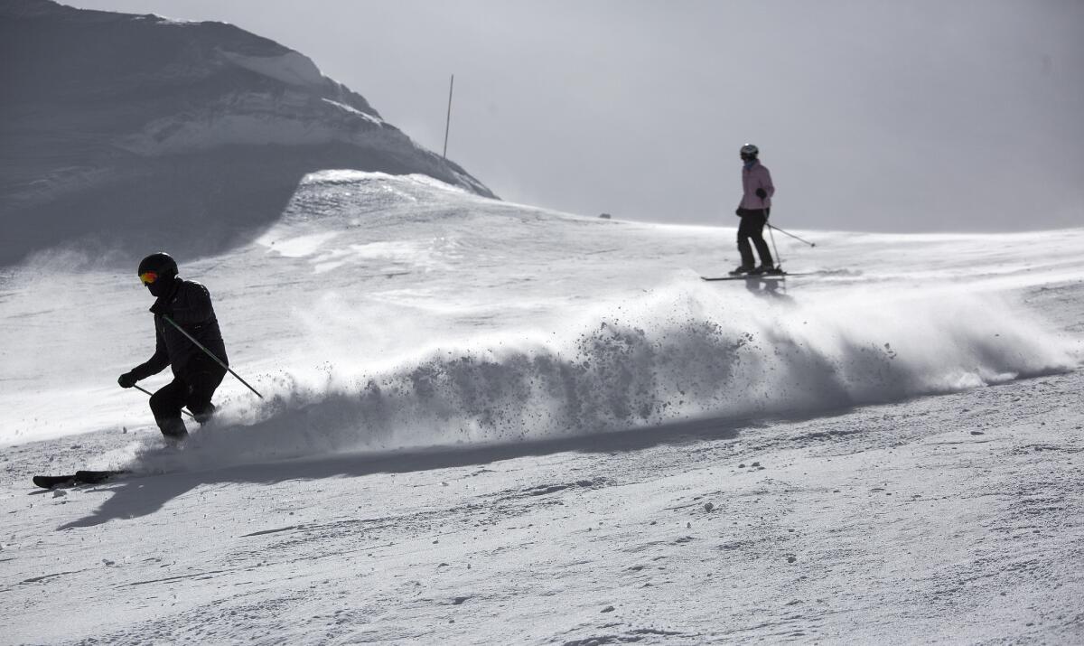 Skiers in the Cornice Bowl enjoy spring-like conditions in early March on the slopes at Mammoth Mountain in Mammoth Lakes. Early-bird passes for next season go on sale today.