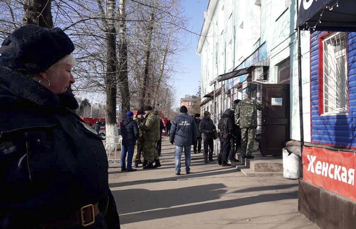 Police secure an area Nov. 14 at a college in Blagoveshchensk, Russia, where one student killed another and wounded three more.
