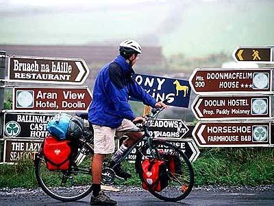 A cyclist stops for directions in County Clare, where the coastal village of Doolin is also the country's traditional music capital.