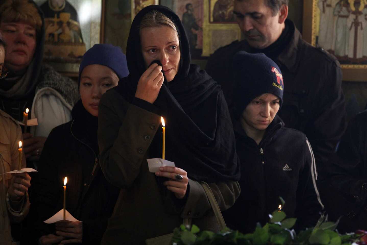 Mourners attend funeral services in Moscow for five teenagers killed by a suspected drunk driver.