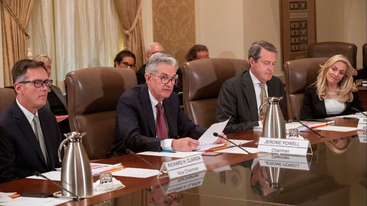Federal Reserve Chairman Jerome Powell, second from left, and other members of the Fed's Board of Governors attend an open meeting of the board on Wednesday that considered changes to banking rules imposed after the financial crisis.