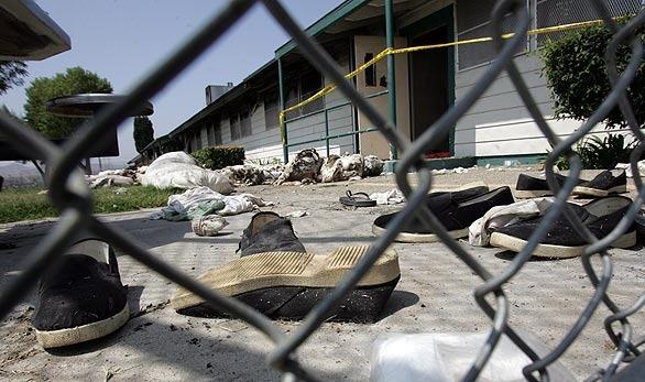 CHINO, CA - AUGUST 19, 2009: Scattered shoes in front of burned out dorm where California Governor Arnold Schwarzenegger saw the destruction first hand at California Institution for Men in Chino prison where prisoners rioted last week, on Wednesday August 19, 2009.