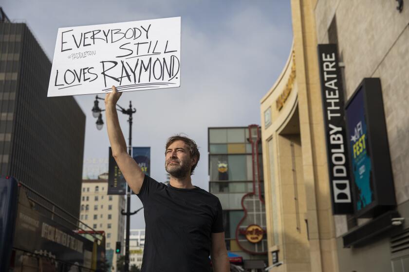 HOLLYWOOD, CA-NOVEMBER 15, 2019: Actor Mark Duplass conducts a one-man awards campaign for his “Paddleton” co-star Ray Romano on Hollywood Blvd. in Hollywood on November 15, 2019. (Mel Melcon/Los Angeles Times)