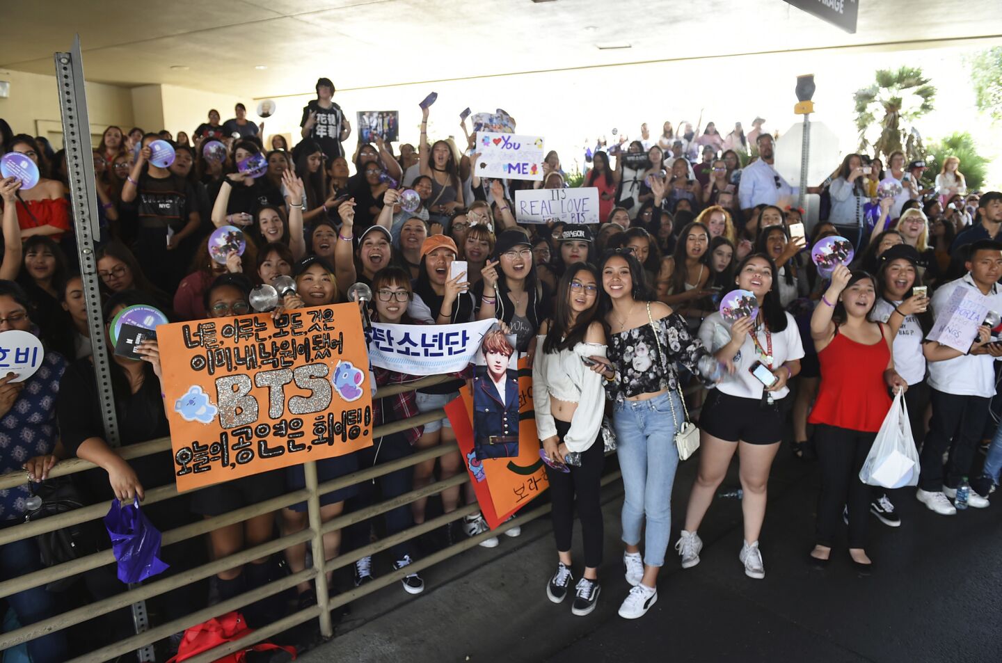 BTS fans wait outside the red carpet before the start of the Billboard Music Awards at the MGM Grand Garden Arena in Las Vegas.