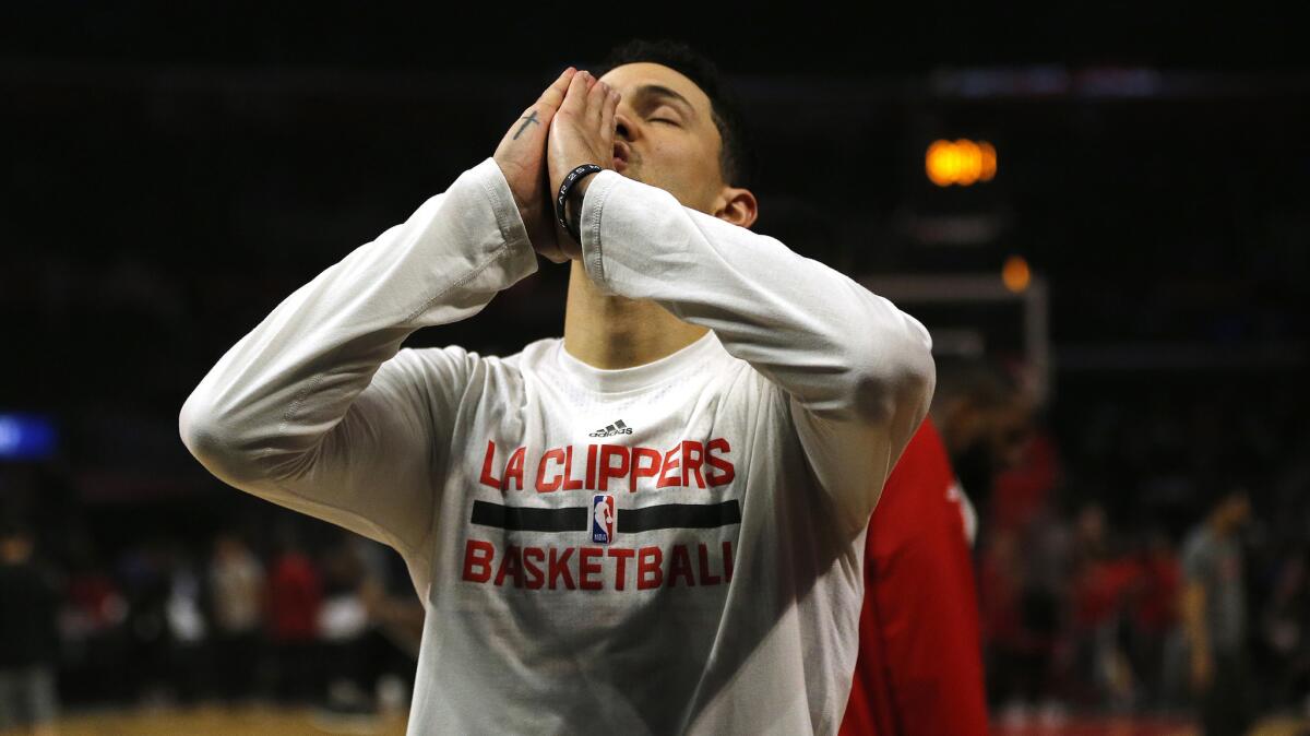 Clippers guard Austin Rivers prays before the game against the Toronto Raptors.