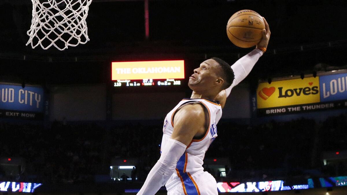 Thunder guard Russell Westbrook goes up for a dunk against the Jazz during the fourth quarter Saturday.