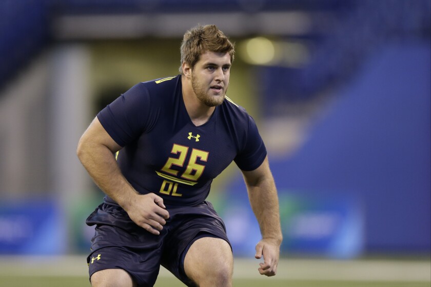 Western Kentucky offensive lineman Forrest Lamp runs a drill at the NFL football scouting combine in Indianapolis.