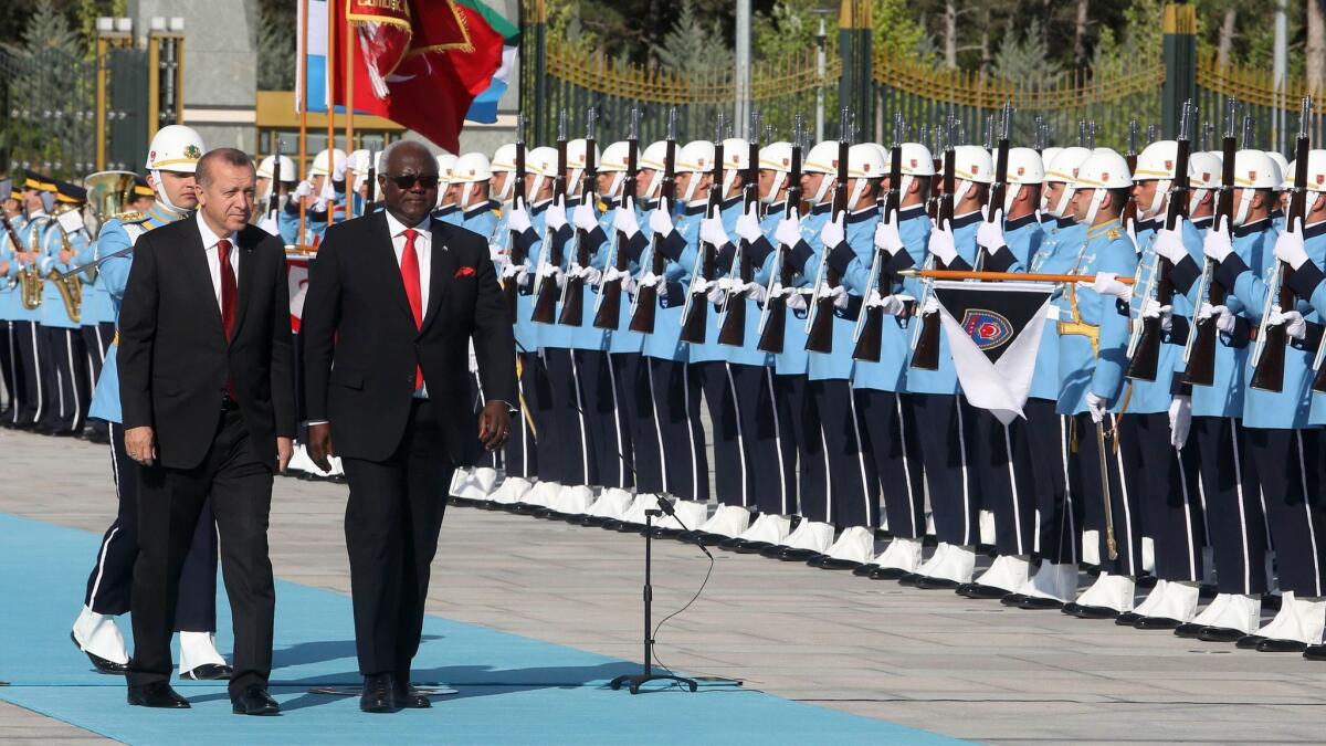Turkish President Recep Tayyip Erdogan, left, welcomes Sierra Leone President Ernest Bai Koroma to the Presidential Complex in Ankara, on May 10, 2017.