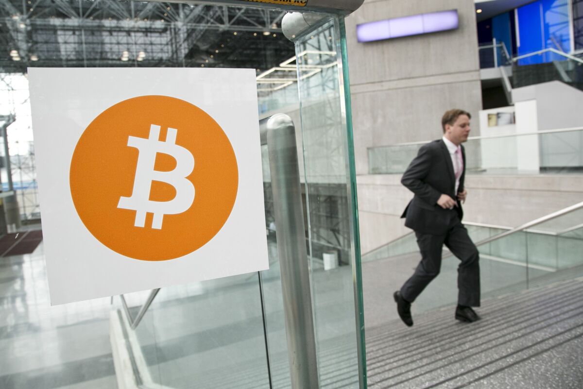 A man arrives for the Inside Bitcoins conference and trade show in New York in April.