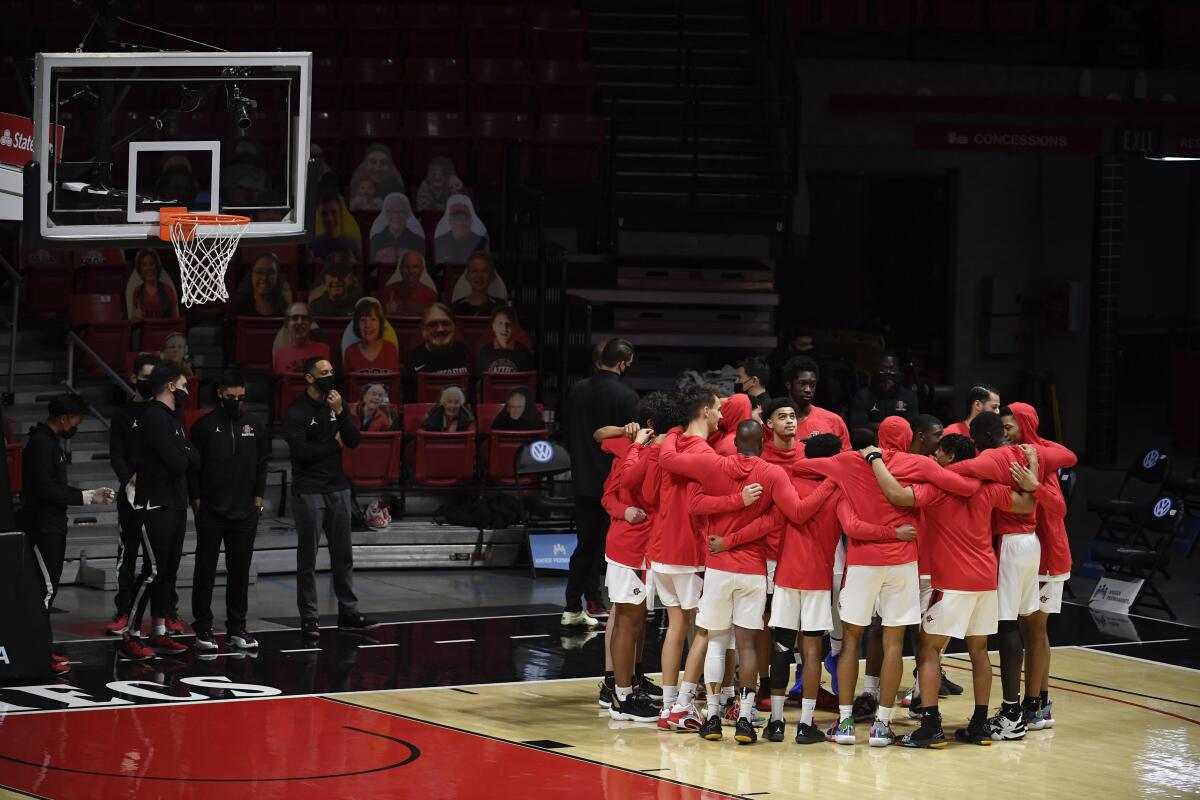 SDSU players huddle before Saturday's 62-58 win against Boise State at Viejas Arena.