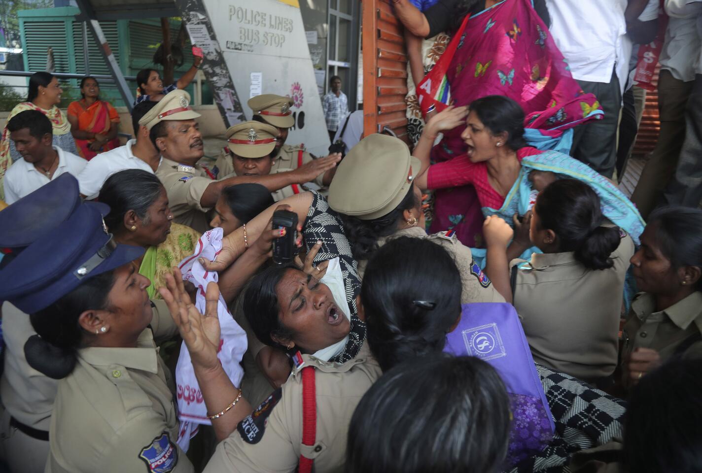 In Hyderabad, anti-Trump protesters are detained by police.