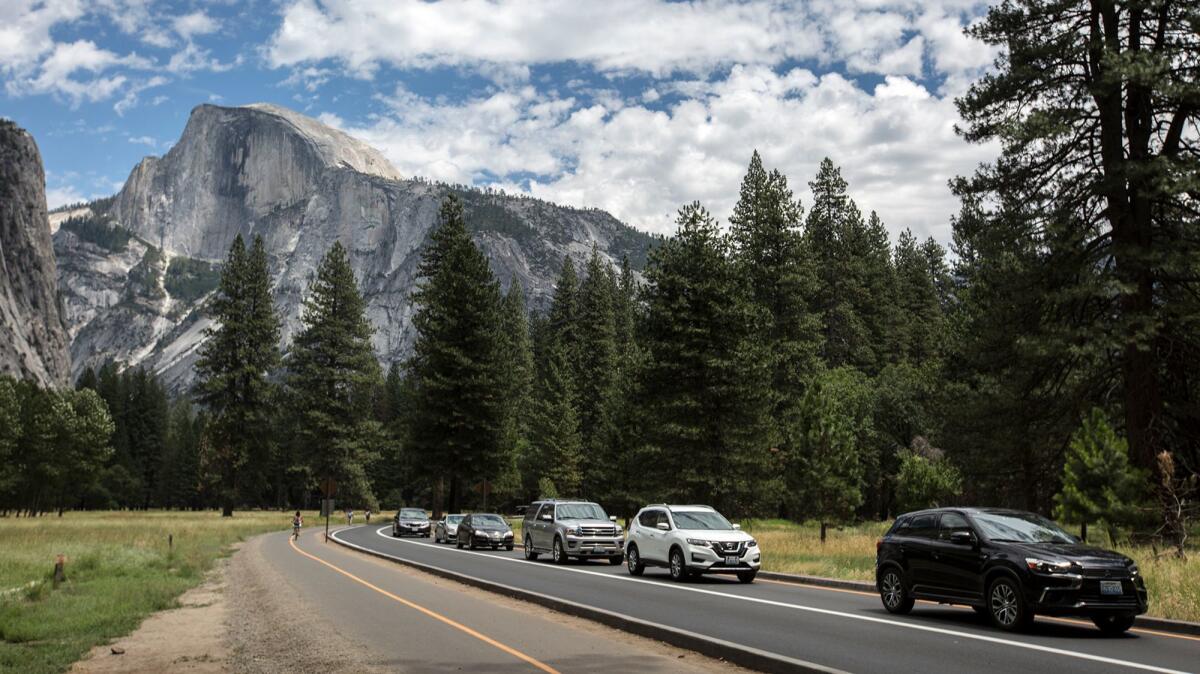 Traffic backs up along the valley floor while a bus lane remains largely open at Yosemite National Park. (Brian van der Brug / Los Angeles Times)