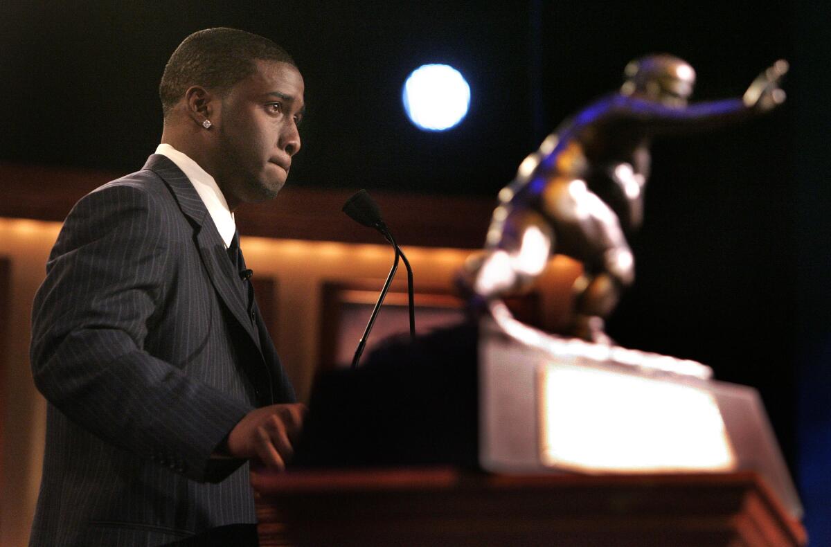 USC tailback back Reggie Bush pauses while delivering his Heisman Trophy acceptance speech in 2005