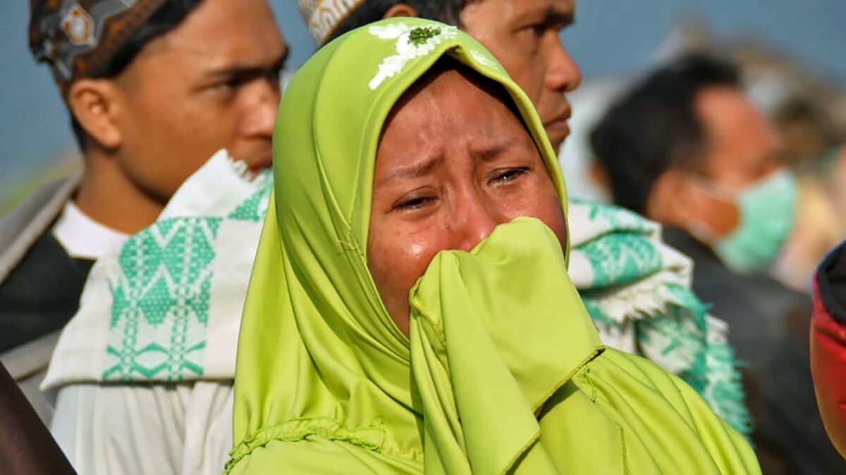 A woman reacts to the damage in Palu, Indonesia.