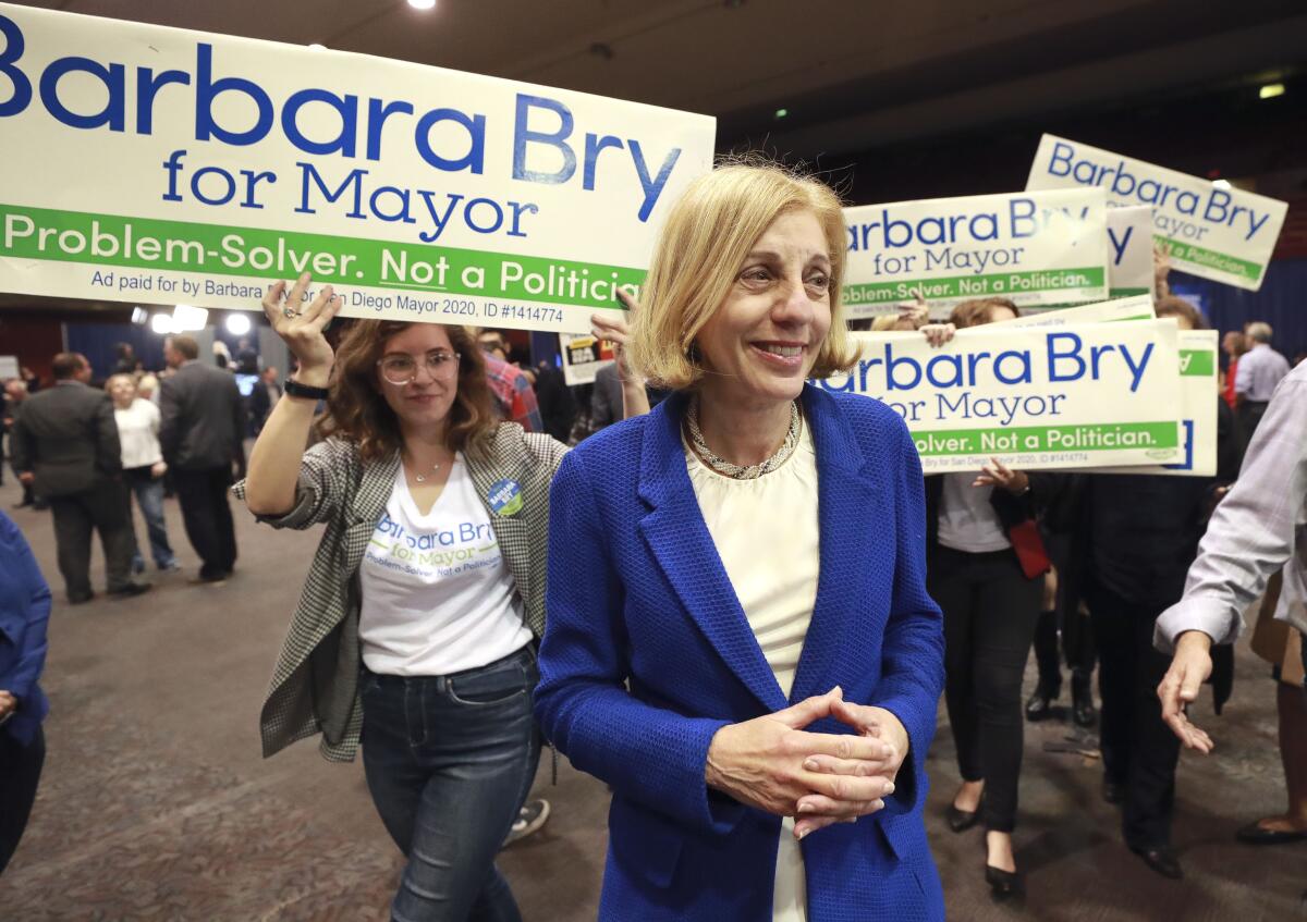 Candidate for San Diego Mayor Barbara Bry walked with her supporters at Golden Hall on Tuesday night.