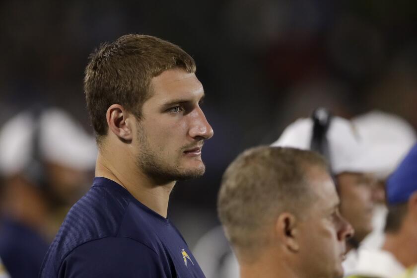 Los Angeles Chargers defensive end Joey Bosa watches from the sideline during the second half of an NFL preseason football game against the Seattle Seahawks Saturday, Aug. 24, 2019, in Carson, Calif. (AP Photo/Gregory Bull)