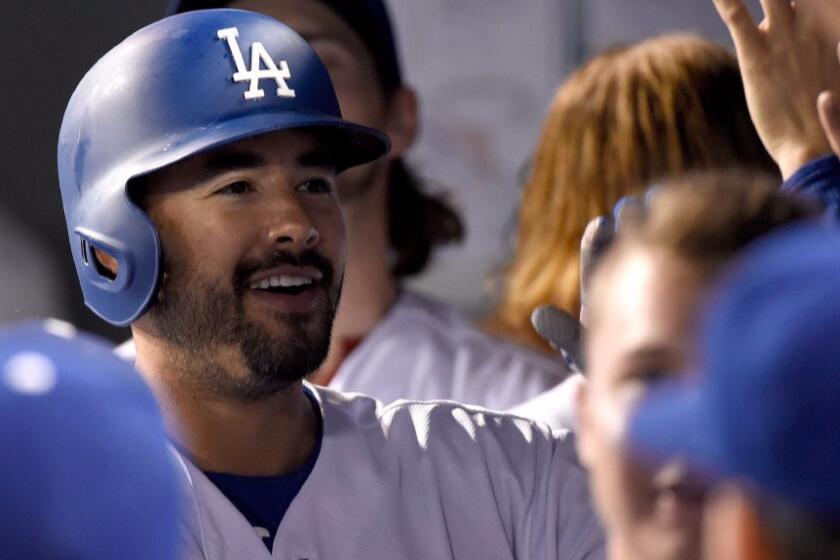 Dodgers outfielder Andre Ethier celebrates in the dugout after hitting a home run against the Rockies during a game on Sept. 23.