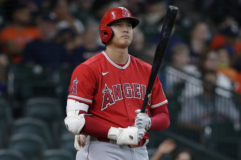 Los Angeles Angels designated hitter Shohei Ohtani approaches the plate to bat.