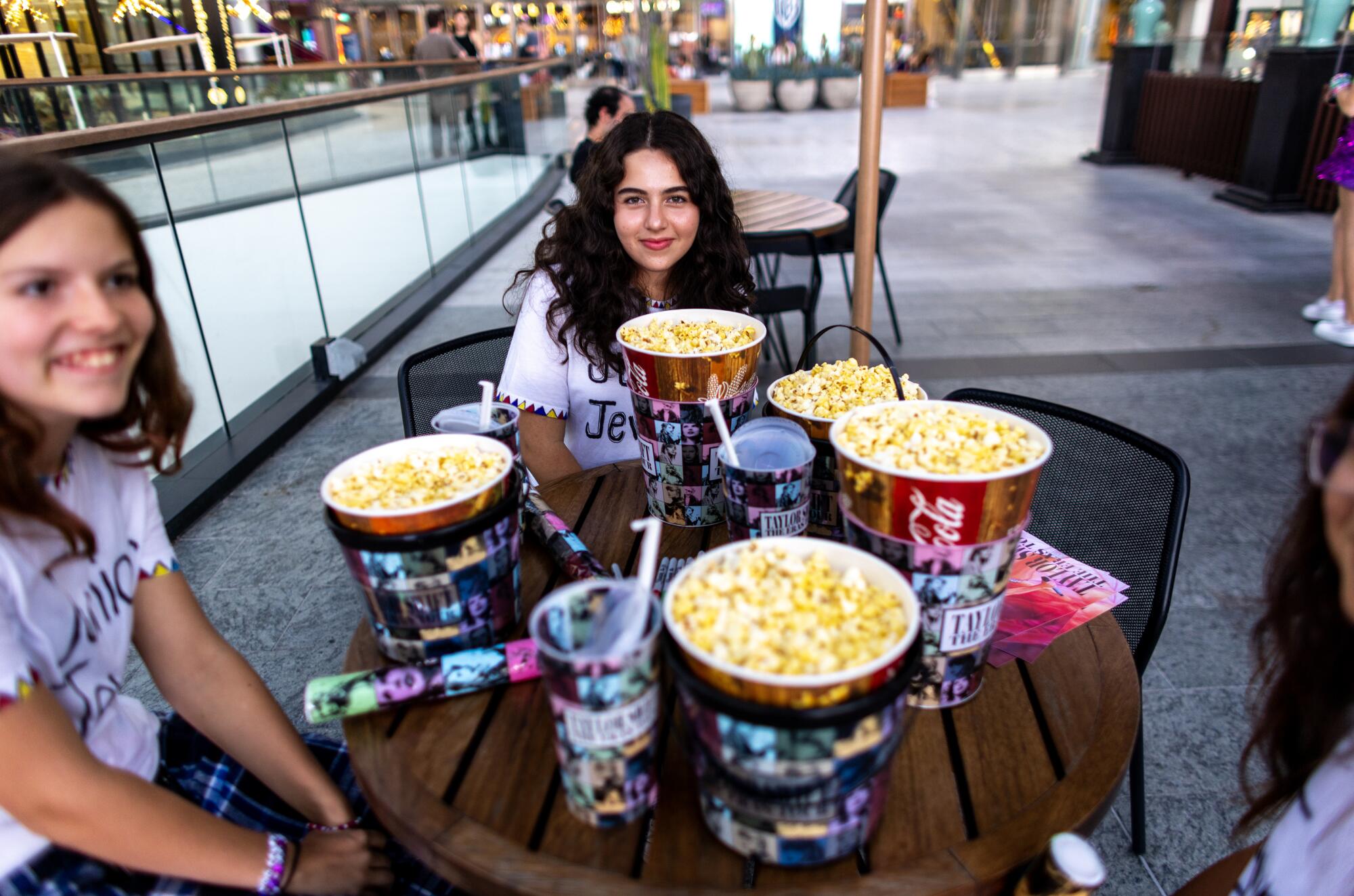 Los Angeles teens arrived an hour early so they stocked up on popcorn before attending the Taylor Swift concert 