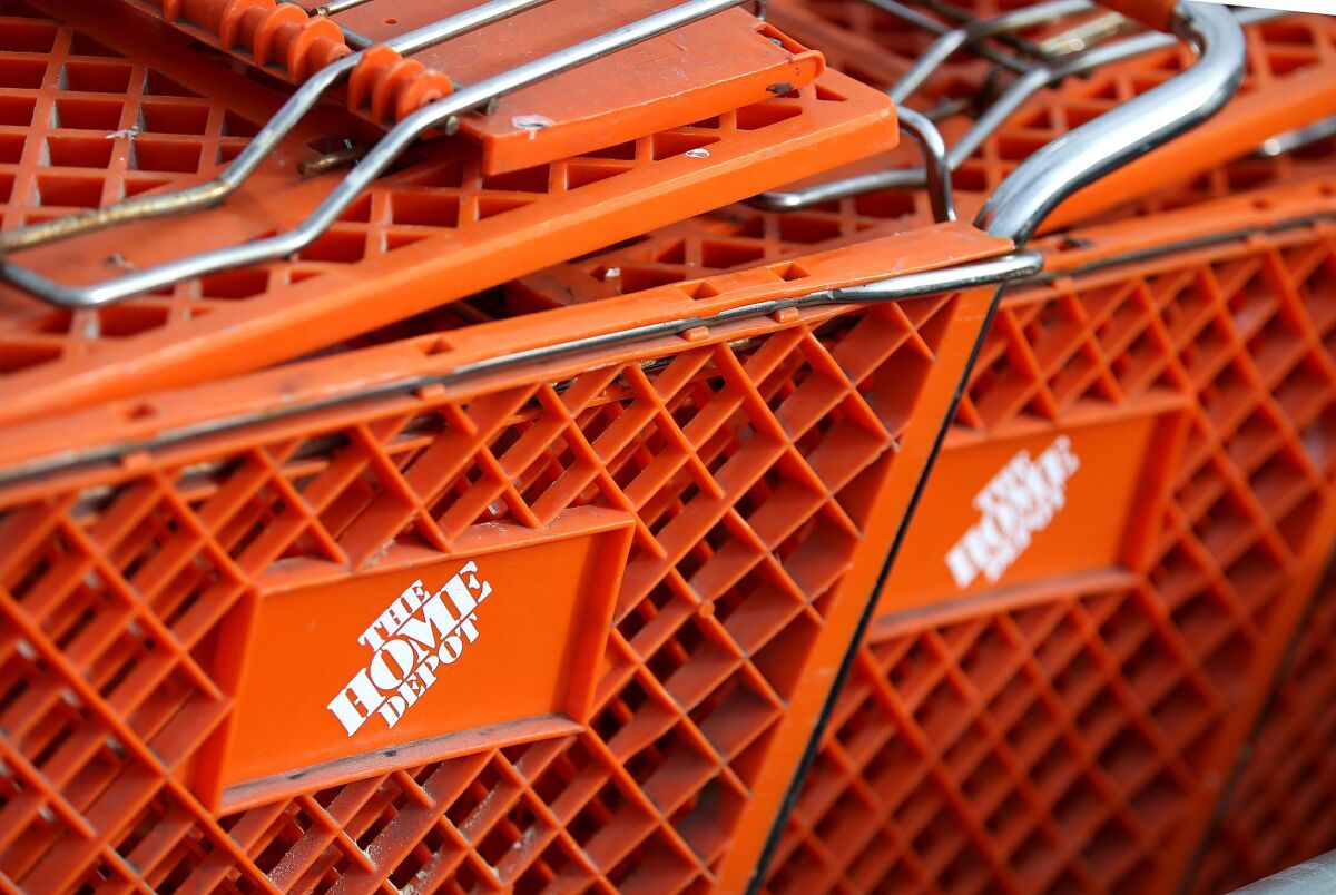 Shopping carts sit in front of a Home Depot store in Daly City, California.
