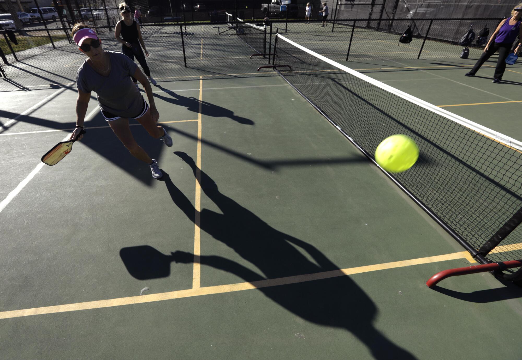 Lisa Streett goes after a ball while playing a game of pickleball at the Goleta Valley Community Center.