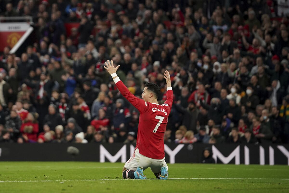 Manchester United's Cristiano Ronaldo reacts during the English Premier League soccer match between Manchester United and West Ham at Old Trafford stadium in Manchester, England, Saturday, Jan. 22, 2022. (AP Photo/Dave Thompson)
