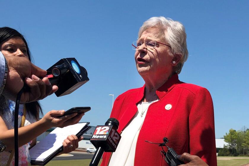 Alabama Gov. Kay Ivey discusses a bill that would virtually outlaw abortion in the state while visiting a car factory at Montgomery, Ala., on Wednesday, May 15, 2019. Ivey, who has described herself as opposing abortion, said she has not yet reviewed the legislation or made a decision on whether to sign it. (AP Photo/Blake Paterson)