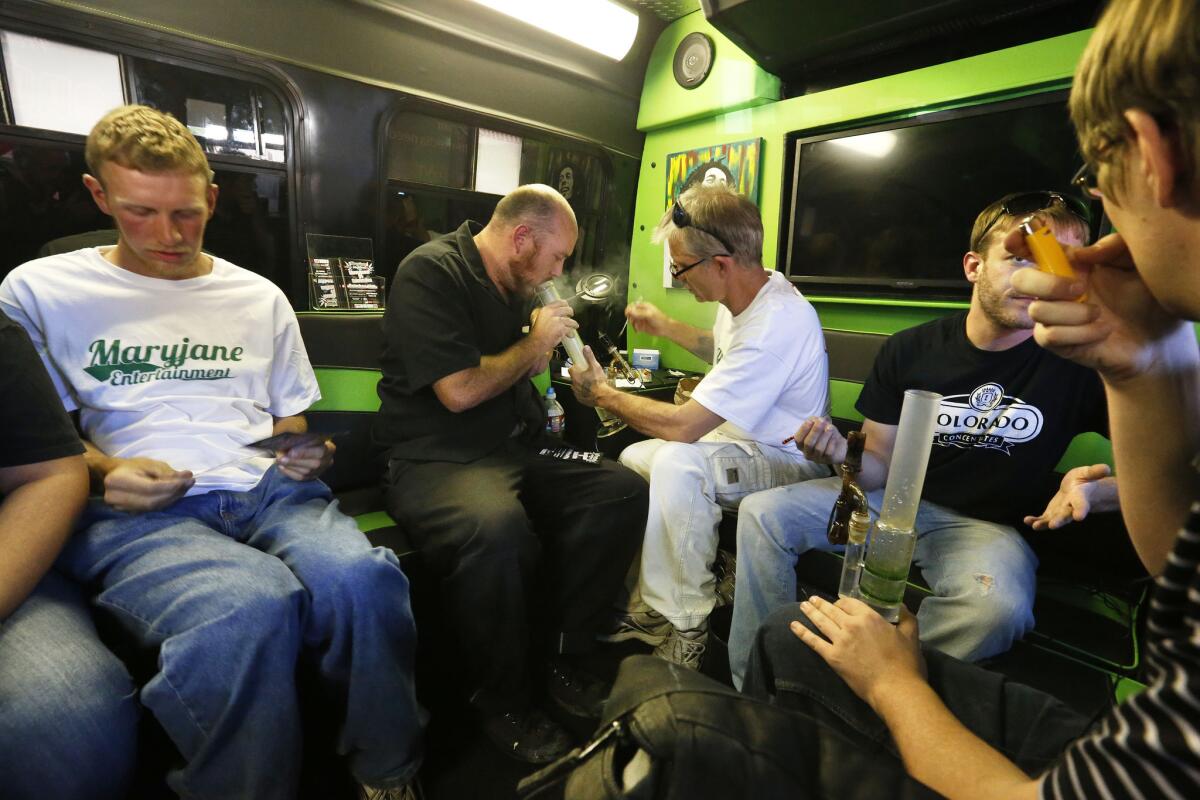 Marijuana activists and operators of a pot tour company, Maryjane Entertainment, give out free samples of marijuana in Denver. A Colorado Department of Revenue study says that income from recreational marijuana sales have been lower than had been projected.