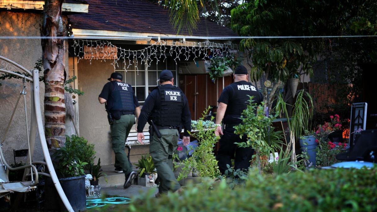ICE agents during a 2015 immigration sweep in Riverside. Immigrant advocates say the Trump administration’s announcement of sweeps starting Sunday are spreading fear in immigrant communities.