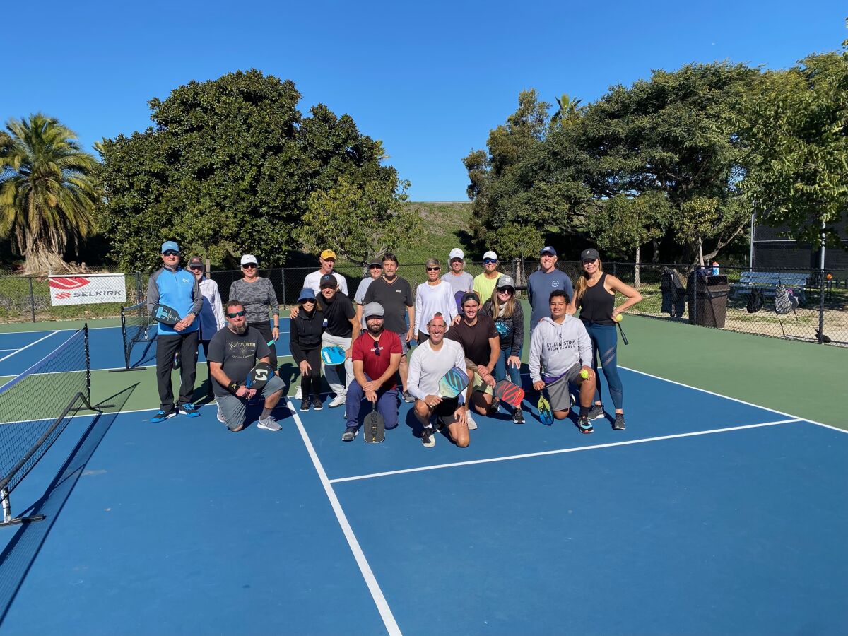Pickleball Association of San Diego co-founders Mike Shinzaki (red shirt) and Stefan Boyland (beside him in white shirt)