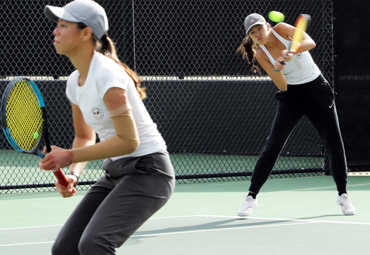 Huntington Beach High tennis sisters Yen Nhi Huynh-Nguyen and Le Nhi Huynh-Nguyen compete.