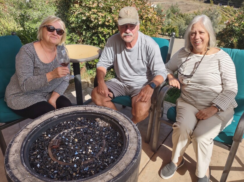 Ramona resident Sally Kloman, left, brings guests Tom Petrakis and Carol Pfister to Ramona Ranch Vineyard & Winery.