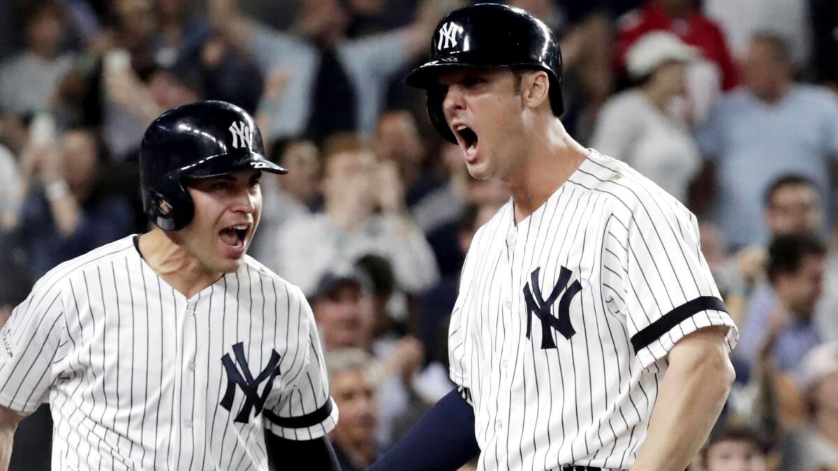 Yankees first baseman Greg Bird, right celebrates with designated hitter Jacoby Ellsbury after hitting a homer against the Indians for the only run in Game 3 of the ALDS on Sunday.