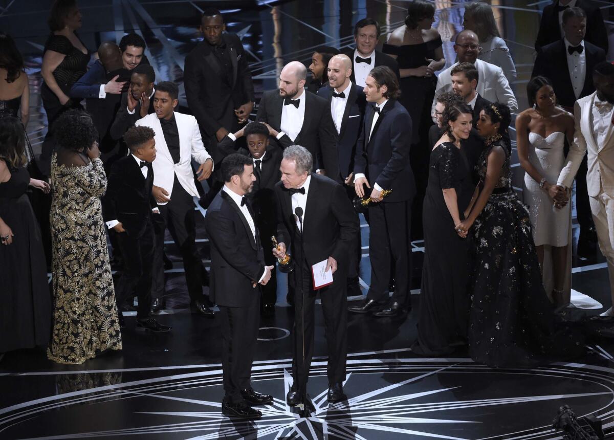 Host Jimmy Kimmel, left, and presenter Warren Beatty discuss the best picture results at the 2017 Oscars.
