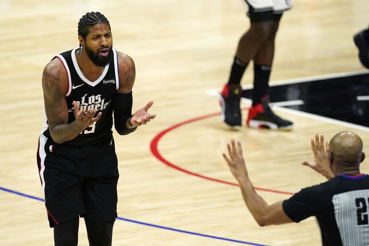 Clippers forward Paul George pleads with referee Tre Maddox.