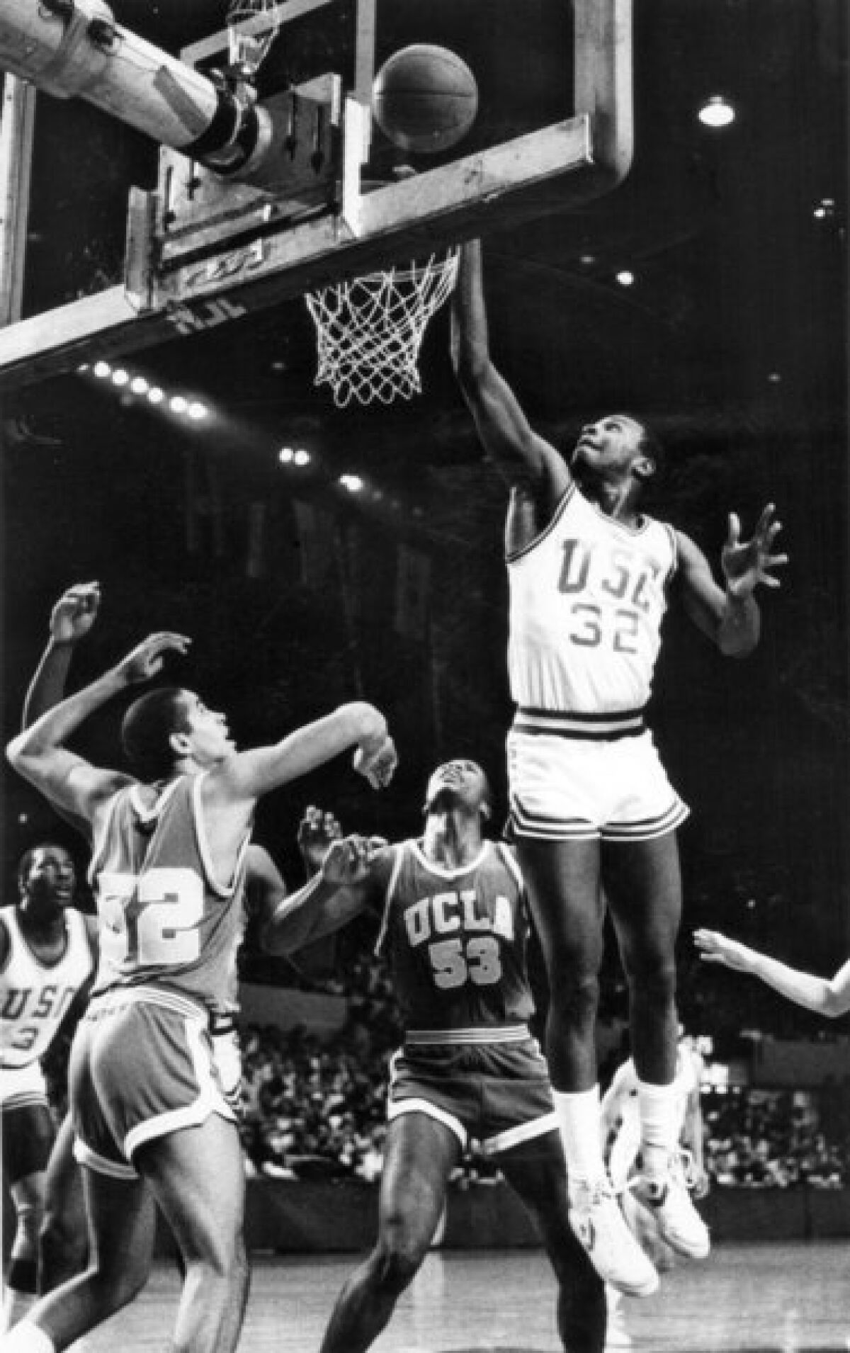 Ron Holmes was a guard on the USC basketball team in the 1980s. Shown scoring against crosstown rival UCLA in February 1985, Holmes did not make it to the NBA, but he was already thinking about his future children's career choices.