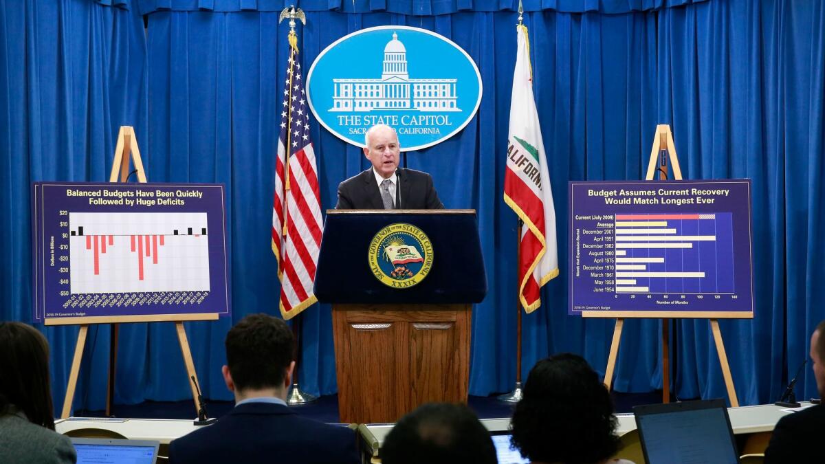 Gov. Jerry Brown discusses his proposed 2018-19 state budget at a news conference Wednesday in Sacramento.