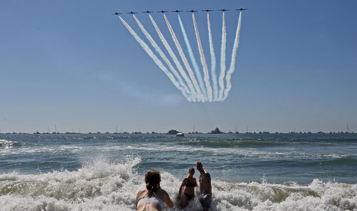 Canadian Forces Snowbirds pass by with a trail of smoke at the Pacific Airshow in Huntington Beach in 2019.