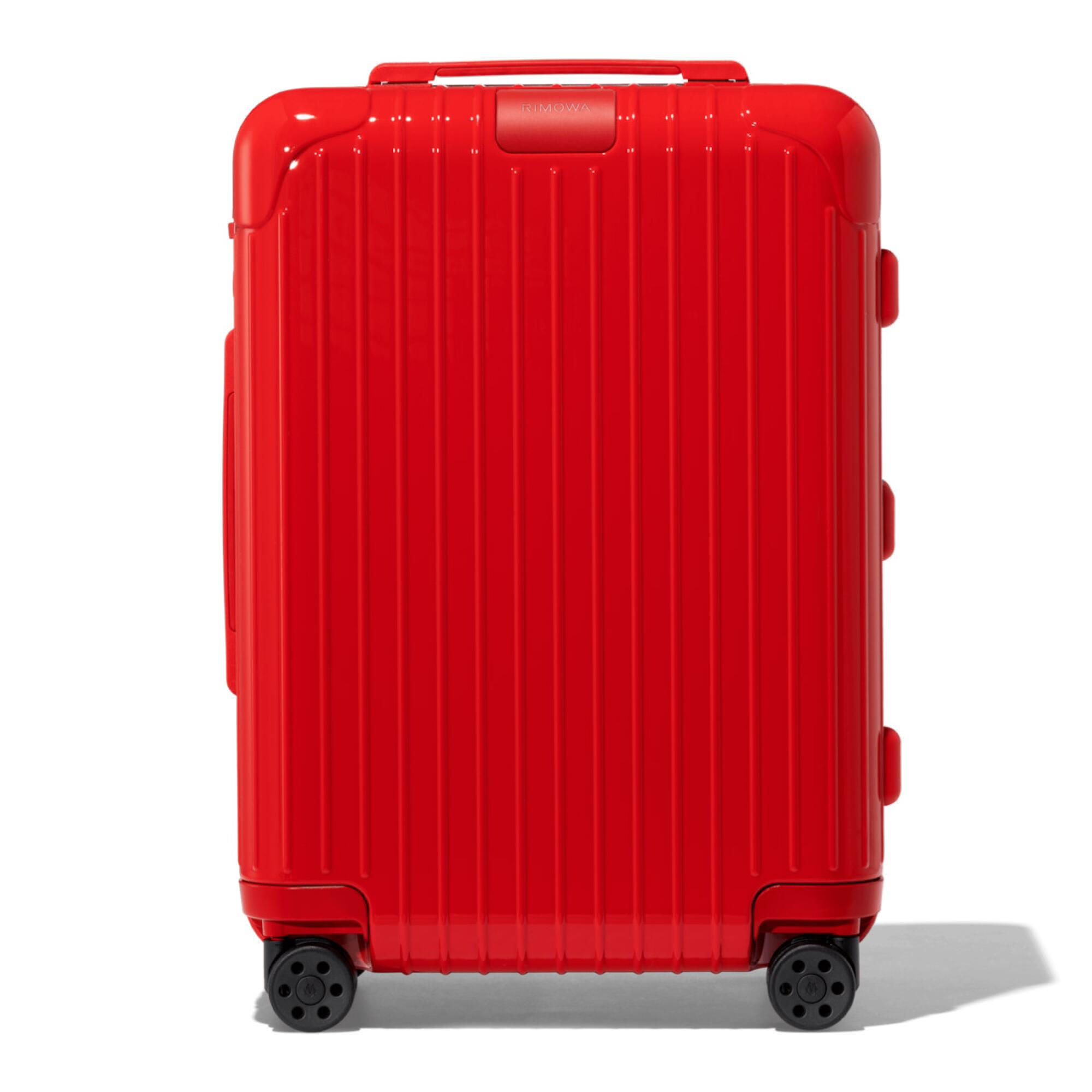 A red wheeled suitcase