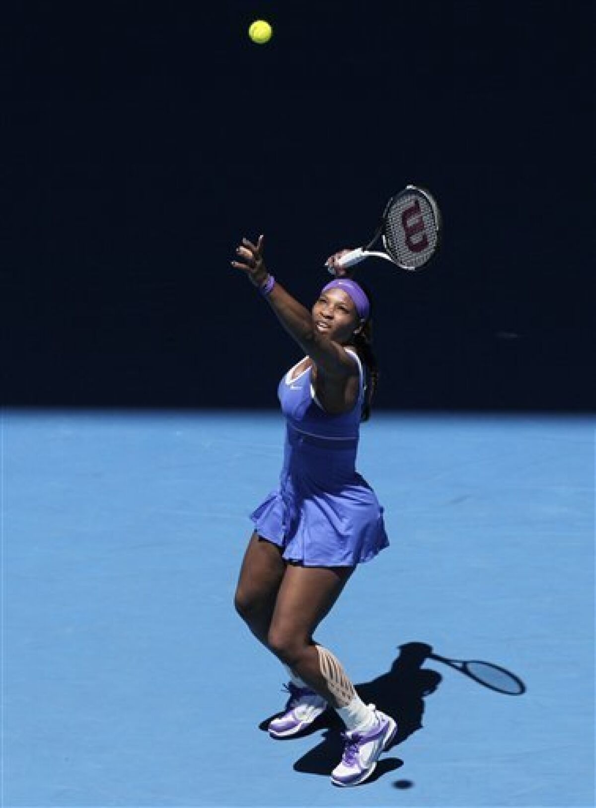 Serena Williams of the US hits a forehand return to Barbora Zahlavova Strycova of the Czech Republic during their second round match at the Australian Open tennis championship, in Melbourne, Australia, Thursday, Jan. 19, 2012. (AP Photo/John Donegan)