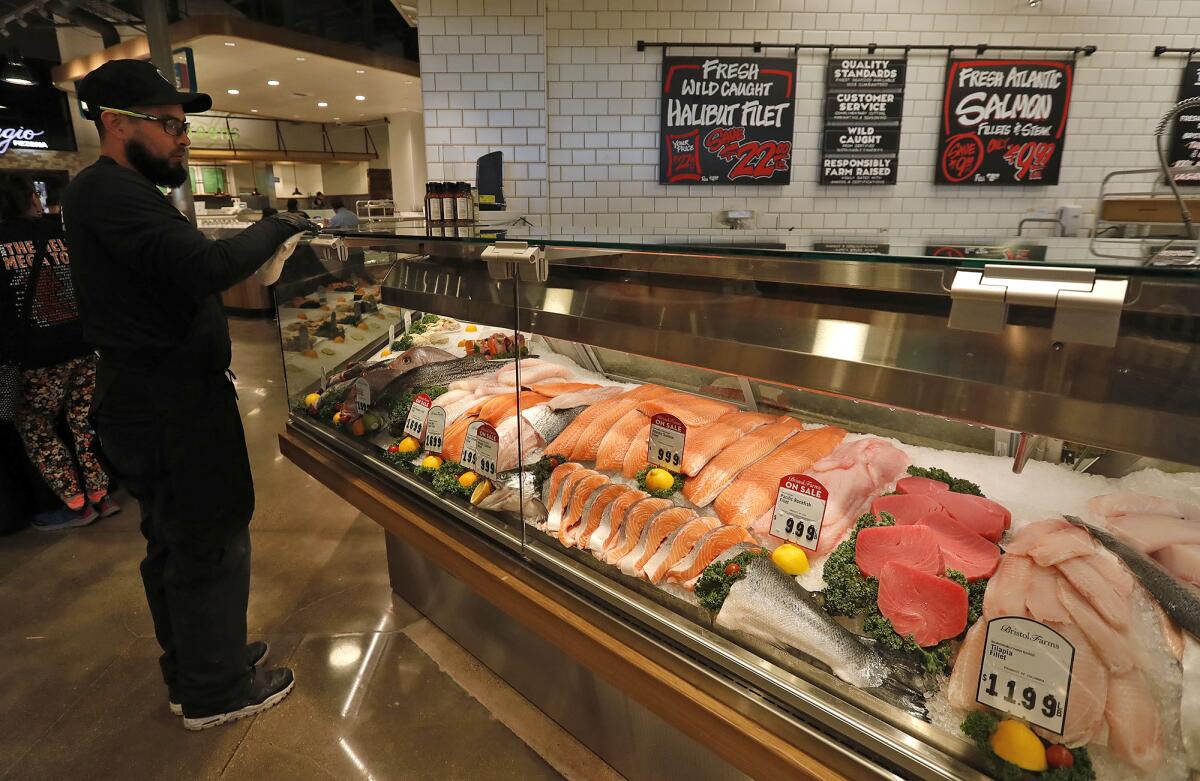 Atlantic salmon and other cuts of fresh fish on display at the new Bristol Farms Newfound Market.