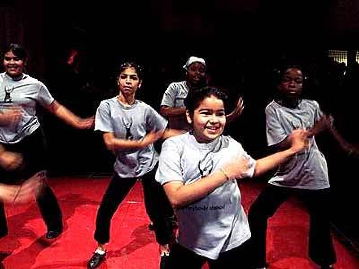 A group of girls performs at a party as part of Everybody Dance, a program created by Liza Bercovici in memory of her 13-year-old daughter, Gabriella.