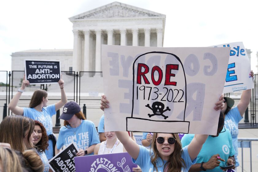 FILE - Demonstrators protest about abortion outside the Supreme Court in Washington, June 24, 2022.Since the Supreme Court overturned Roe just nine months ago, 24 states have banned abortion outright or are likely to do so, according to the Guttmacher Institute. Other states with Republican-controlled legislatures, including Florida, are moving toward restrictive laws that would ban abortion as soon as six weeks of pregnancy. (AP Photo/Jacquelyn Martin, File)